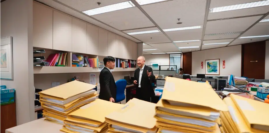 Lawyers at Lee Bon Leong & Co in discussion at the firm's office.